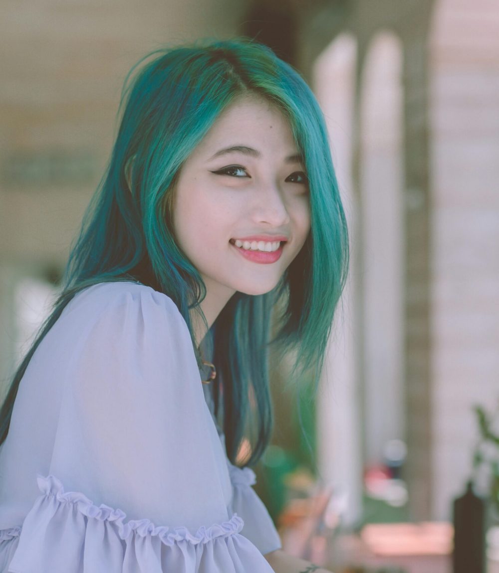 accounting virtual assistant smiling with green hair